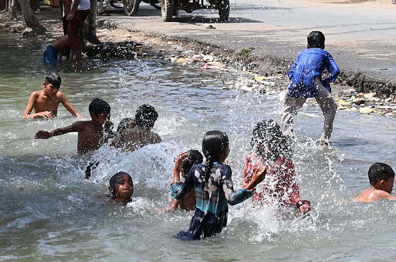 Children enjoying bath in a canal at Muradabad