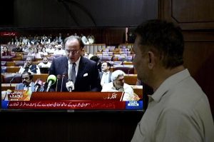 A citizen's eyes are fixed on the screen on the budget speech of Finance Minister Muhammad Aurangzeb as he presents the Federal Budget 2026-27 in the National Assembly at Parliament House, reflecting the widespread public interest in the country's economic direction and fiscal policies