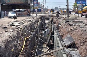 Laborers on work during the construction work of the underpass at Kabutar Chowk, Ring Road