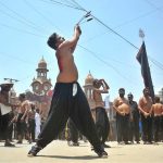 Mourners oozing themselves with knives and chains during the main Ashura procession on the 10th of Muharram-ul-Haram at Ghanta Ghar Chowk. Muharram-ul-Haram is the first month of the Islamic calendar, observed as a month of mourning in remembrance of the martyrdom (Shahadat) of Hazrat Imam Hussain (R.A.), the grandson of the Holy Prophet Muhammad (PBUH)