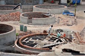 Labourers are engaged in the construction of a sewage disposal system at Chungi No. 9 as part of an ongoing development project to improve civic infrastructure in the city.