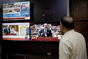 A citizen's eyes are fixed on the screen on the budget speech of Finance Minister Muhammad Aurangzeb as he presents the Federal Budget 2026-27 in the National Assembly at Parliament House, reflecting the widespread public interest in the country's economic direction and fiscal policies