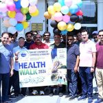 Business community leader Sheikh Riazuddin and President of the Sialkot Chamber of Commerce and Industry Syed Ehtesham Mazhar Gilani lead the Health Walk 2026