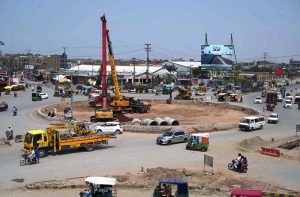 Laborers on work during the construction work of the underpass at Kabutar Chowk, Ring Road