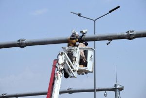 IT engineers install CCTV cameras to enhance surveillance and security along the Expressway in the federal capital.