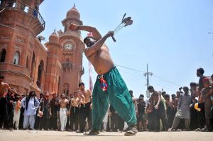 Mourners oozing themselves with knives and chains during the main Ashura procession on the 10th of Muharram-ul-Haram at Ghanta Ghar Chowk. Muharram-ul-Haram is the first month of the Islamic calendar, observed as a month of mourning in remembrance of the martyrdom (Shahadat) of Hazrat Imam Hussain (R.A.), the grandson of the Holy Prophet Muhammad (PBUH)