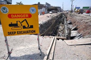 Laborers on work during the construction work of the underpass at Kabutar Chowk, Ring Road