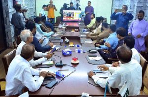 Members of the Hyderabad Chamber of Small Traders and Small Industry watch the live Federal Budget 2026–27 session on television screen at the chamber’s office