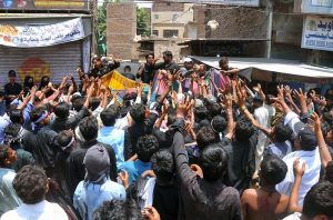 Mourners oozing themselves with knives and chains during the main Ashura procession on the 10th of Muharram-ul-Haram at Ghanta Ghar Chowk. Muharram-ul-Haram is the first month of the Islamic calendar, observed as a month of mourning in remembrance of the martyrdom (Shahadat) of Hazrat Imam Hussain (R.A.), the grandson of the Holy Prophet Muhammad (PBUH)