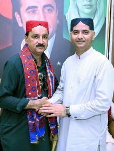 Mayor Larkana Advocate Anwar Ali Luhur congratulates APP Photographer Larkana Nadeem Akhtar Soomro on being elected unopposed to a Governing Body seat of the Larkana Press Club during a luncheon hosted in honor of the newly elected office-bearers at his residence .