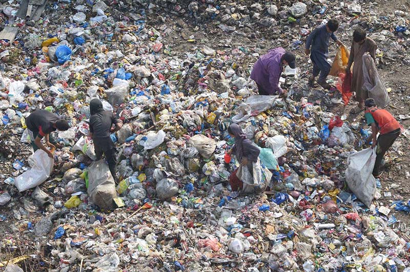 Gypsy children search for reusable or recyclable materials from a garbage dumping in the Provincial Capital
