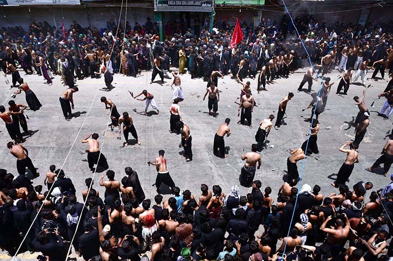 Mourners oozing themselves with knives and chains during Ashura procession at Station Road on 10th of Holy Month of Muharramul Harram. Muharram is the mourning month in remembrance of the Shahadat of Imam Hussain (RA) the grandson of the Holy Prophet Mohammad (PBUH)