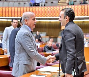 Prime Minister Muhammad Shehbaz Sharif shakes hands with Chairman Pakistan People's Party Bilawal Bhutto Zardari in the National Assembly.