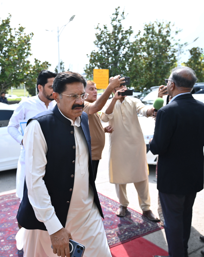 A parliamentarian arrives at Parliament House ahead of the National Assembly session for the presentation of the Federal Budget FY2026–27 in the federal capital