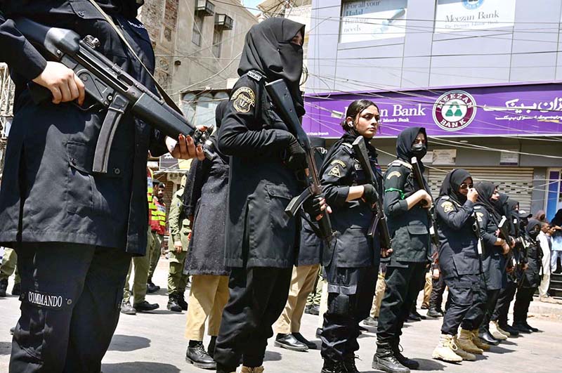 Women commandos stands high alert during the Ashura procession at Station Road on the 10th of Holy Month of Muharramul Harram. Muharram is the mourning month in remembrance of the Shahadat of Imam Hussain (RA) the grandson of the Holy Prophet Mohammad (PBUH)