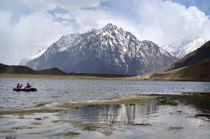 A mesmerizing view of Shandur Lake, a stunning alpine glacial lake at 3,700 meters on the Shandur Plateau, lying at the border of Chitral and Ghizer near the iconic Shandur Polo Ground