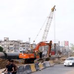A view of the development work of RedLine BRT is underway with the help of heavy machinery near Expo center in the Provincial Capital