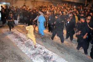 Mourners walking on burning coals during a procession on 9th of Murramul Harram at Tando Jahania. Muharramul Haram is known as the first month of the Islamic calendar and the mourning month in remembrance of the martyrdom (Shahadat) of Hazrat Imam Hussain (RA), the grandson of the Holy Prophet Mohammad (PBUH)
