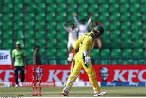 Australian batsman Alex Carey walks back to the pavilion after being bowled by Shaheen Shah Afridi during the second One Day International (ODI) between Pakistan and Australia at Gaddafi Stadium.