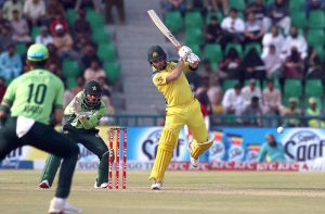 Australian Batter Josh Inglis plays a shot during the third one-day international (ODI) cricket match between Pakistan and Australia at Gaddafi Stadium.
