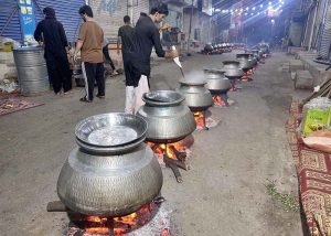 Cook busy preparing traditional food (Haleem) during 9th of Holy Month of Muharramul Harram at Saddar