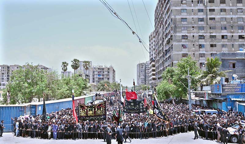 A large number of mourners attending Ashura procession on 10th of the Holy Month of Muharram-ul-Harram passing through Empress Market. Muharram is the mourning month in remembrance of the Shahadat of Hazrat Imam Hussain (RA), the Grandson of the Holy Prophet Mohammad (PBUH)
