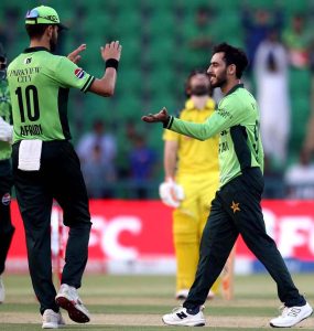 Australian batsman Alex Carey walks back to the pavilion after being bowled by Shaheen Shah Afridi during the second One Day International (ODI) between Pakistan and Australia at Gaddafi Stadium.