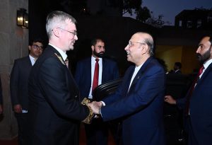 President Asif Ali Zardari shaking hands with Ambassador Albert P. Khorev of the Russian Federation at a reception held to mark the National Day of the Russian Federation.
