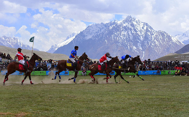 Players from Gilgit-Baltistan and Chitral battle fiercely during the final of the Shandur Polo Festival 2026, as thousands of spectators packed on the surrounding hillsides watch the thrilling contest that Gilgit-Baltistan won 6-5 to end a 12-year wait for victory over their traditional rivals at the world’s highest historic Shandur polo Ground