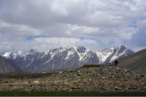 Tourists enjoy boating in Shandur Lake, a breathtaking alpine glacial lake at 3,700 meters on the Shandur Plateau, located between Chitral and Ghizer