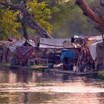 A view of makeshift shelters established along the Nau Bahar Canal, where informal settlements have transformed the canal's riverside environment