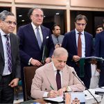 Prime Minister Muhammad Shehbaz Sharif signing Annual Budget 2026-27 documents after its approval by the Federal Cabinet meeting at Parliament House
