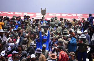 A Gilgit-Baltistan player lifts the Shandur Polo Festival 2026 trophy aloft amid jubilant celebrations after defeating Chitral 6-5 in a thrilling final at the historic Shandur Polo Ground, ending a 12-year wait for victory over their traditional rivals at the world's highest polo ground