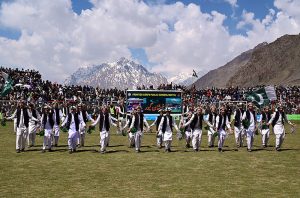 Students perform a traditional cultural dance during the closing ceremony of the Shandur Polo Festival 2026 at the historic Shandur Polo Ground, as thousands of spectators watch against the stunning backdrop of snow-capped mountains, following Gilgit-Baltistan's thrilling 6-5 victory over Chitral in the final that ended a 12-year wait for glory over their traditional rivals at the world's highest polo ground