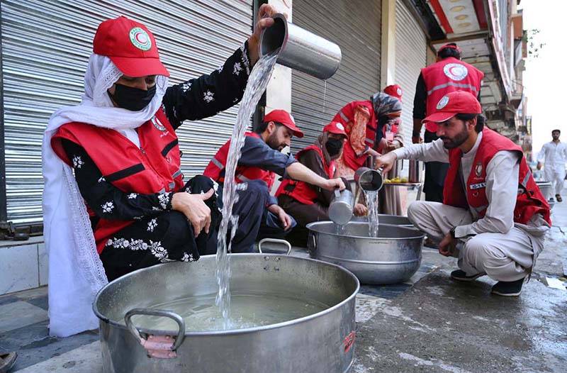 ICRC volunteers preparing summer drink to serve the mourners attending the procession on 10th of the Muharram-ul-Harram at Kuchi Bazaar. Muharram-ul-Harram is known as the first month of the Islamic calendar and the mourning month in remembrance of the martyrdom (Shahadat) of Hazrat Imam Hussain (RA), the grandson of the Holy Prophet Mohammad (PBUH)
