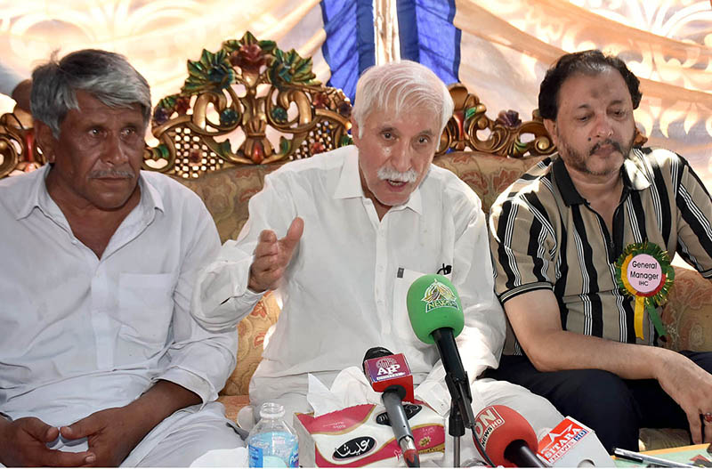 Federal Minister for Investment Board Qaiser Ahmed Sheikh talks to media during a free medical camp organized under the supervision of Islamia Hospital at Chak no 134 Loony Wala