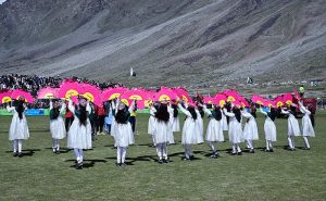 Students perform a traditional cultural dance during the closing ceremony of the Shandur Polo Festival 2026 at the historic Shandur Polo Ground, as thousands of spectators watch against the stunning backdrop of snow-capped mountains, following Gilgit-Baltistan's thrilling 6-5 victory over Chitral in the final that ended a 12-year wait for glory over their traditional rivals at the world's highest polo ground