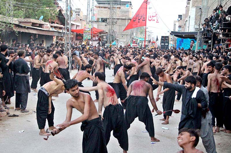Mourners oozing themselves with knives and chains during the procession on 9th of the Holy Month of Muharramul Haram passing through Rahmatpur Road. Muharramul Haram is known as the first month of the Islamic calendar and the mourning month in remembrance of the martyrdom (Shahadat) of Hazrat Imam Hussain (RA), the grandson of the Holy Prophet Mohammad (PBUH)