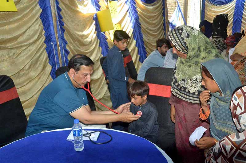 A physician examines a young child during a free medical camp organised for underprivileged citizens during a free medical camp organized under the supervision of Islamia Hospital at Chak no 134 Loony Wala
