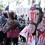 Mourners touches a Zuljinah during the Ashura procession on 10th of the Muharram-ul-Harram. Muharram-ul-Harram is the first month of the Islamic calendar known as the mourning month in remembrance of the martyrdom (Shahadat) of Hazrat Imam Hussain (RA), the grandson of the Holy Prophet Muhammad (PBUH)