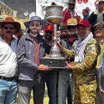 Secretary Tourism Gilgit-Baltistan, Sardar Asad Haroon, along with other officials present the Shandur Polo Festival 2026 trophy to the winning Gilgit-Baltistan team captain at the historic Shandur Polo Ground, following their thrilling 6-5 victory over Chitral in the final
