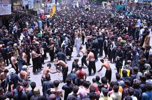 Mourners touches a Zuljinah during the Ashura procession on 10th of the Muharram-ul-Harram. Muharram-ul-Harram is the first month of the Islamic calendar known as the mourning month in remembrance of the martyrdom (Shahadat) of Hazrat Imam Hussain (RA), the grandson of the Holy Prophet Muhammad (PBUH)