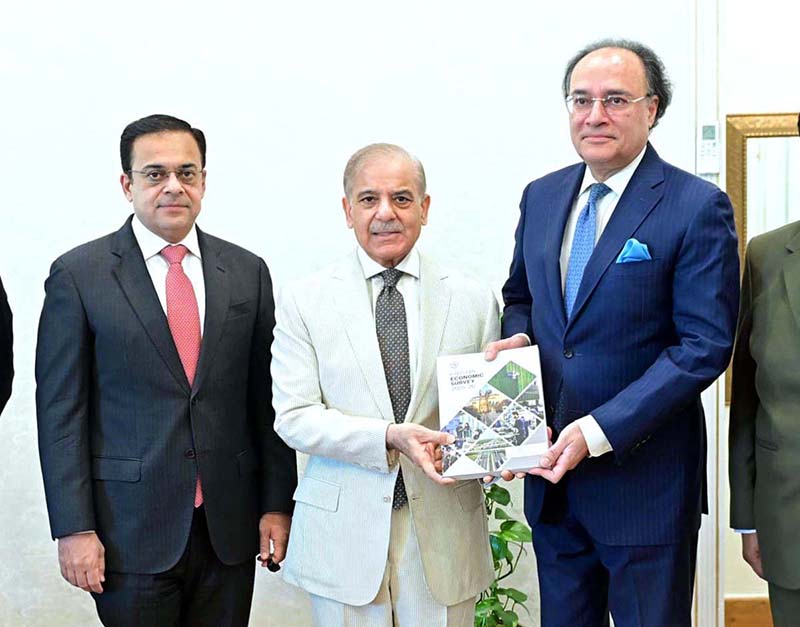 Federal Minister for Finance Muhammad Aurangzeb presents the copy of Pakistan Economic Survey-2025-26 to the Prime Minister Muhammad Shehbaz Sharif