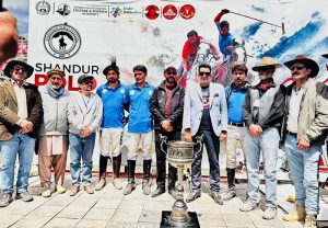 Secretary Tourism Gilgit-Baltistan, Sardar Asad Haroon, along with other officials present the Shandur Polo Festival 2026 trophy to the winning Gilgit-Baltistan team captain at the historic Shandur Polo Ground, following their thrilling 6-5 victory over Chitral in the final