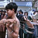 Mourners self-flagellation with knives and chains during the Ashura procession on 10th of the Muharram-ul-Harram at Tibet Center. Muharram-ul-Harram is the first month of the Islamic calendar known as the mourning month in remembrance of the martyrdom (Shahadat) of Hazrat Imam Hussain (RA), the grandson of the Holy Prophet Muhammad (PBUH)