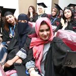 Newly graduated doctors take selfies during the second convocation of Sargodha Medical College