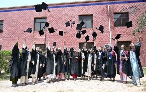 Newly graduated doctors throw their caps in the air in a traditional celebration during the second convocation of Sargodha Medical College