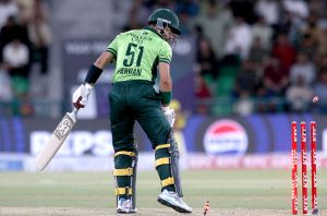 Pakistani players Shadab Khan and Abdul Samad celebrate and shake hands with the Australian players after winning the third One-day International (ODI) cricket match between Pakistan and Australia at Gaddafi Stadium.