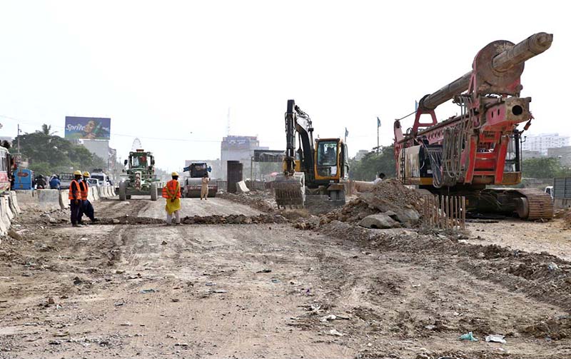A view of the development work of Red Line BRT is underway with the help of heavy machinery at University Road in the Provincial Capital