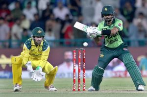 Pakistani players Shadab Khan and Abdul Samad celebrate and shake hands with the Australian players after winning the third One-day International (ODI) cricket match between Pakistan and Australia at Gaddafi Stadium.